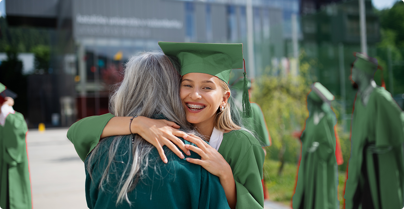 University student celebrating graduation with family